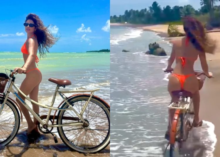 Paula Fernandes faz charme durante passeio de bicicleta na praia